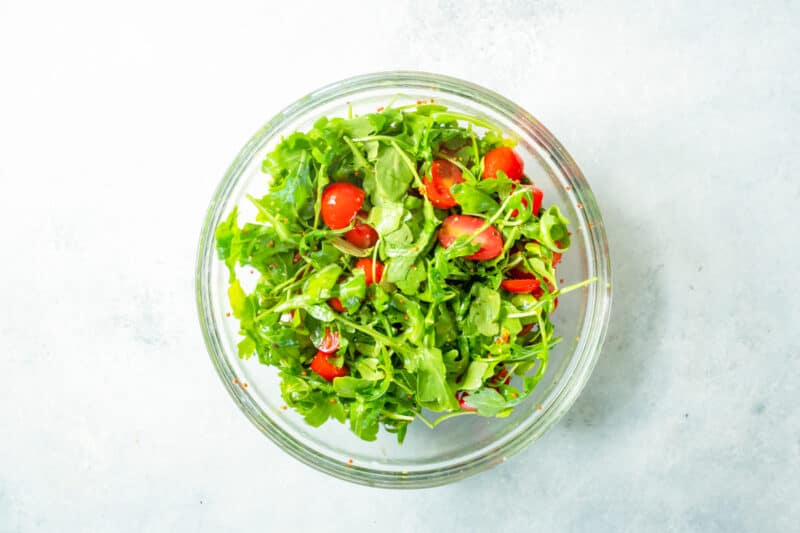 greens and tomatoes in a bowl