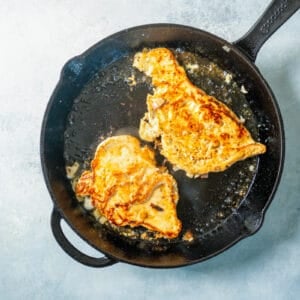 frying chicken in a skillet