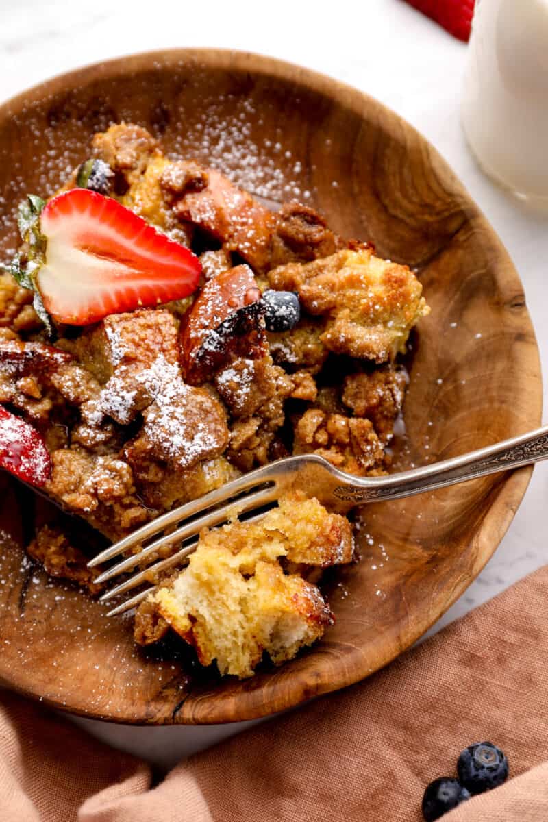 a bowl of French toast casserole with a fork