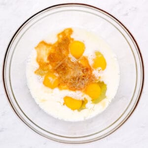 eggs and seasonings in a glass bowl