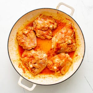 seasoned chicken thighs in a pot