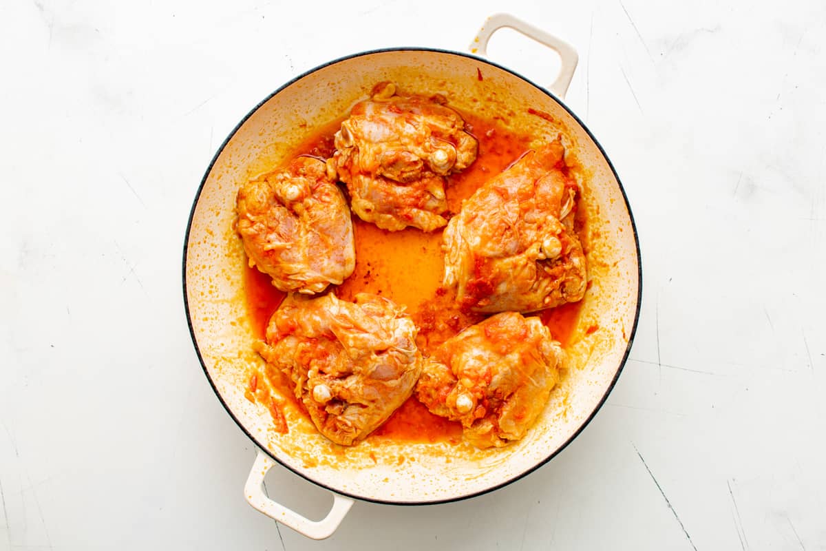 seasoned chicken thighs in a pot