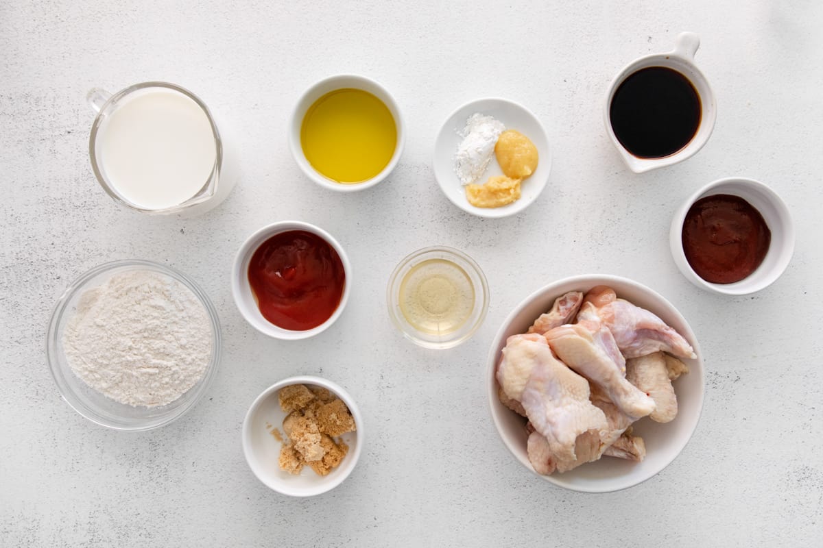 Ingredients for Korean BBQ wings: raw chicken wings, soy sauce, gochujang, ginger, ketchup, buttermilk.