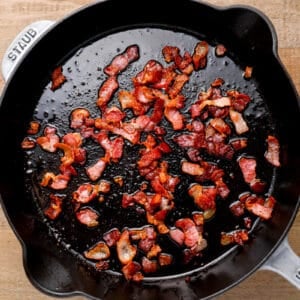 cooking bacon bits in a skillet