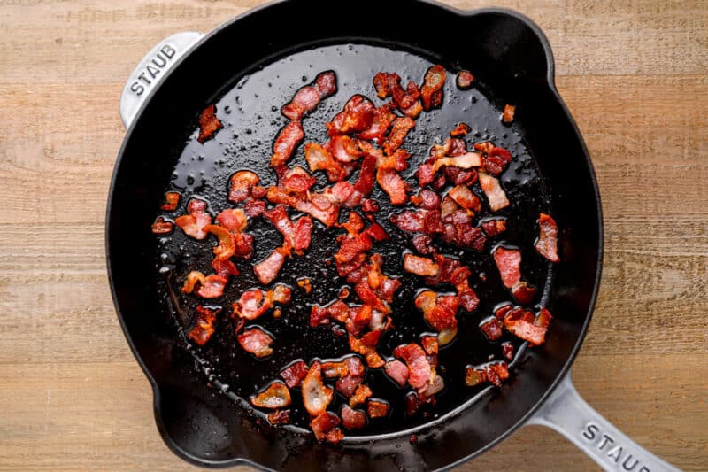 cooking bacon bits in a skillet