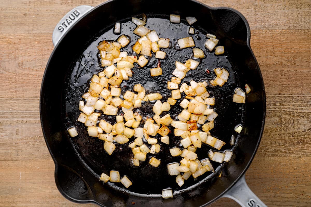 cooking onions in a skillet
