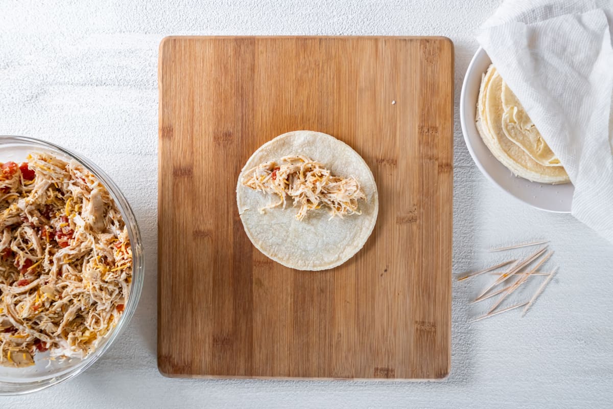 how to fold chicken taquito on a cutting board