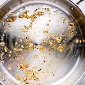 sautéing aromatics in a pan