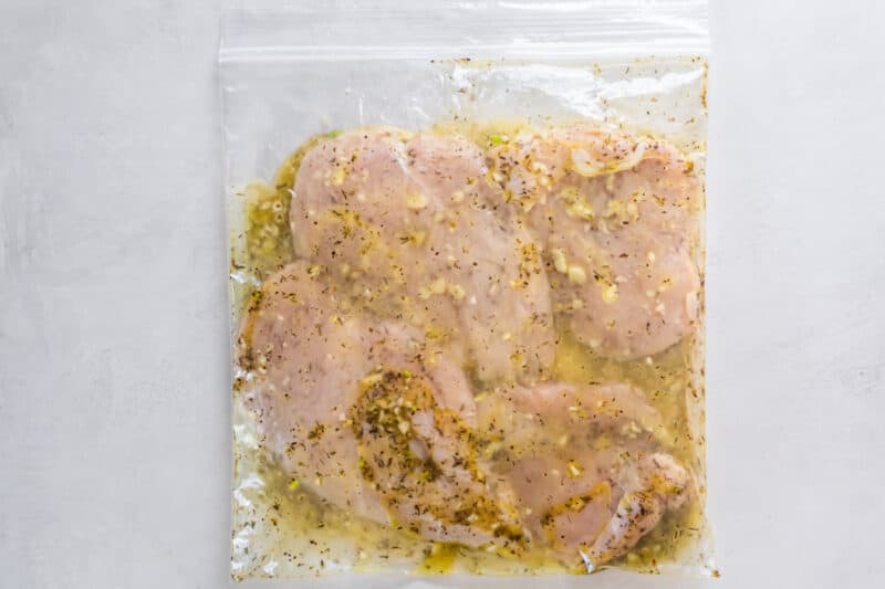 chicken breasts marinating in a resealable bag