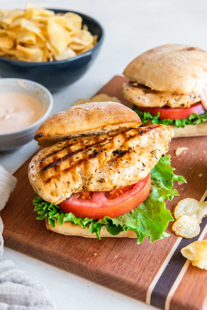 grilled chicken sandwiches on a cutting board