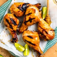 overhead view of grilled honey lime chicken drumsticks.