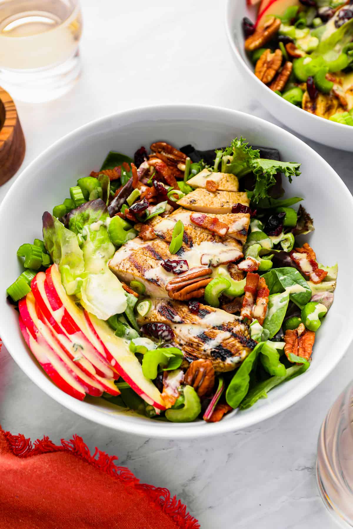 fall salad topped with chicken and harvest salad dressing