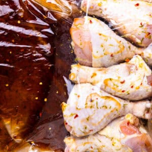 marinating chicken drumsticks in honey lime.