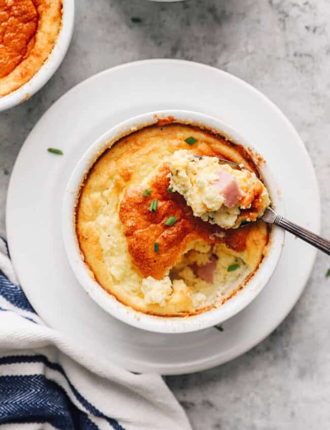 spoon digging into a breakfast souffle