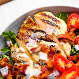 partial view of honey mustard chicken salad in a white bowl.