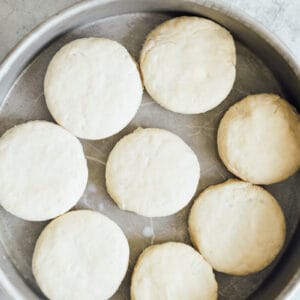 unbaked biscuits in a round pan