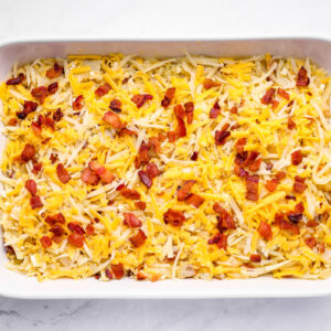 casserole topped with shredded cheese before baking
