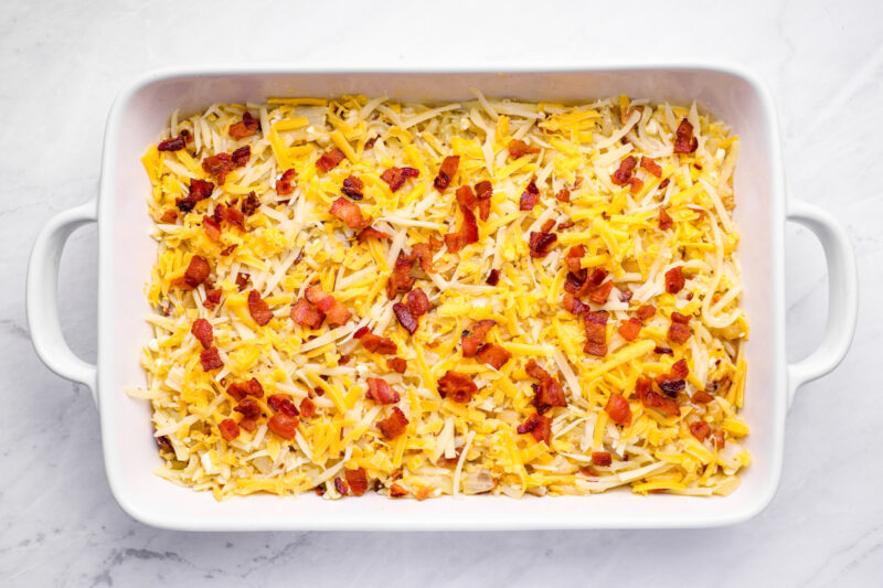 casserole topped with shredded cheese before baking