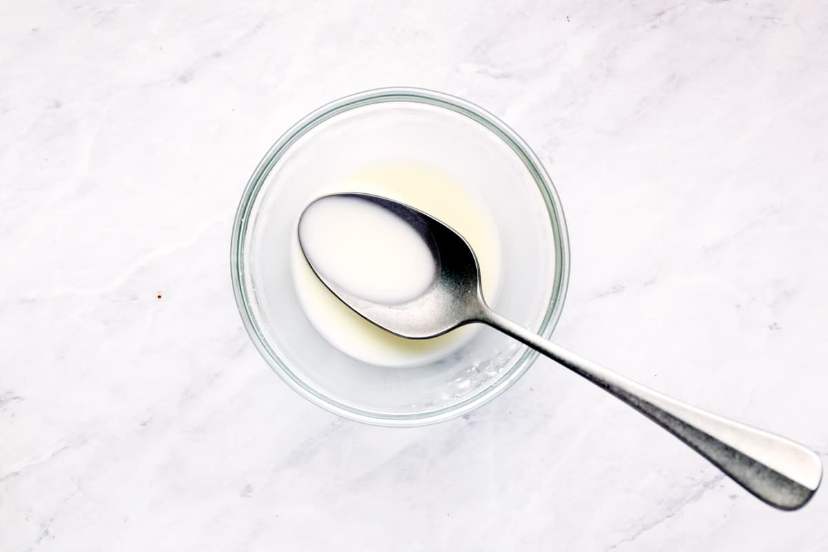 Cornstarch slurry in a small glass bowl.