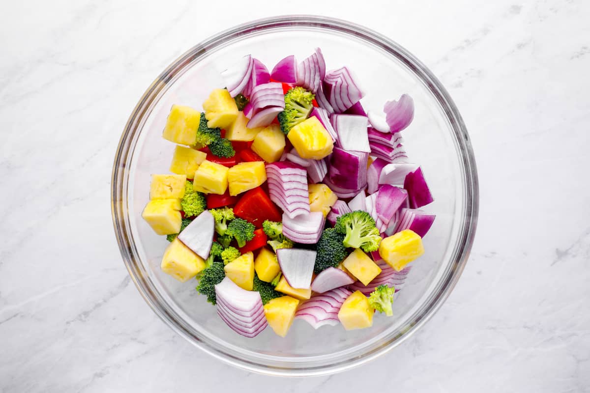 uncooked chopped vegetables in a mixing bowl