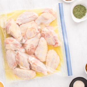 chicken wings marinating in a resealable bag