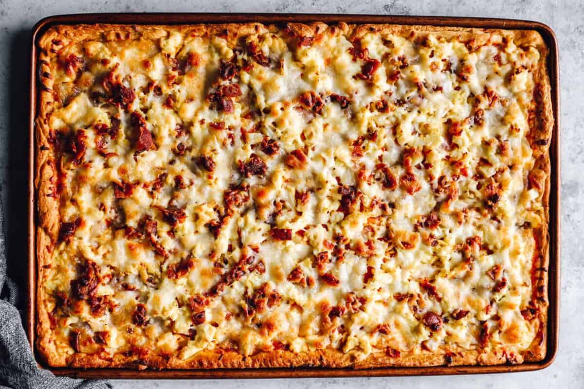 overhead view of crescent roll breakfast pizza in a sheet pan.