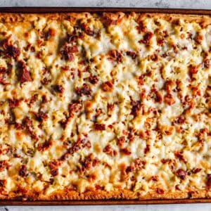 overhead view of crescent roll breakfast pizza in a sheet pan.