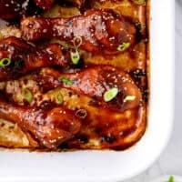 close up on a baking dish filled with baked teriyaki chicken