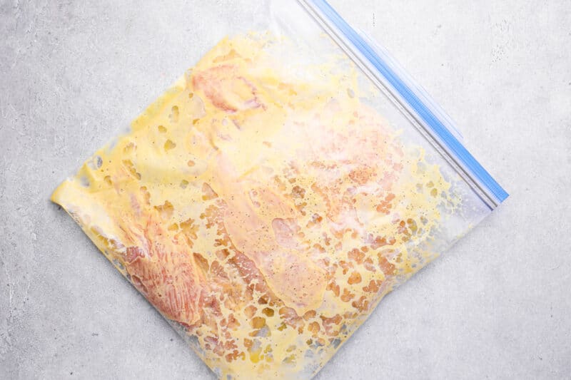 chicken breasts and honey mustard marinade in a ziplock bag.