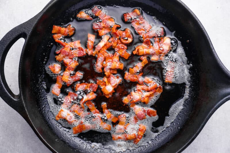 chopped bacon in a cast iron pan.