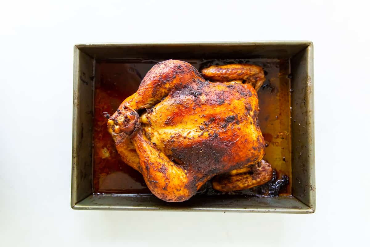 Roasted rotisserie chicken in a pan.