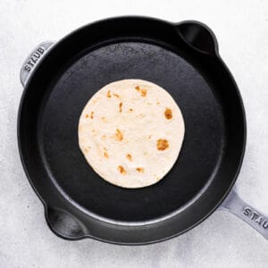 tortilla cooking in a skillet