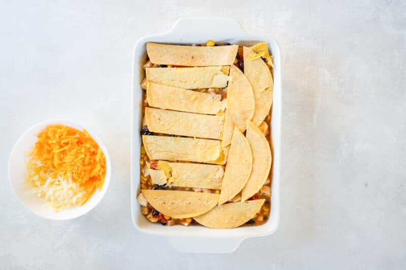 casserole topped with tortillas, before baking