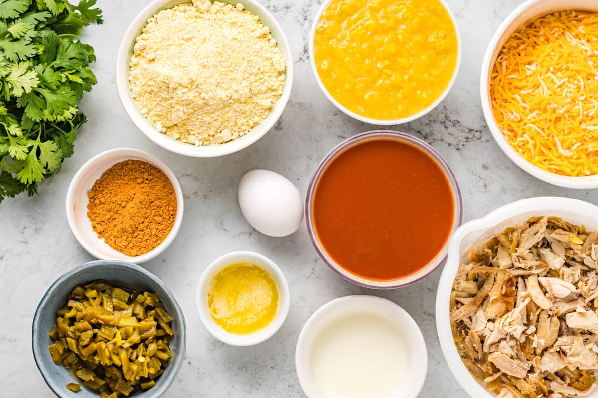 Ingredients for chicken and cornbread tamale pie arranged in bowls.