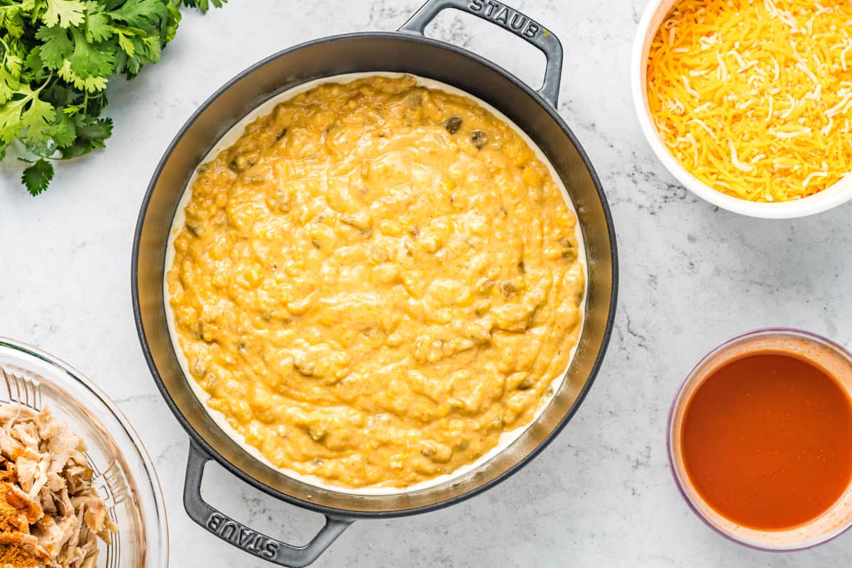 Cornbread mixture spread into baking dish.