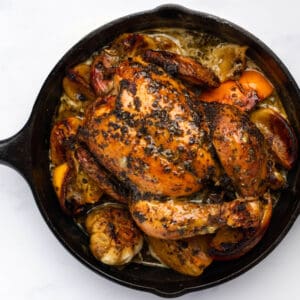 roasted christmas chicken in a cast iron skillet.