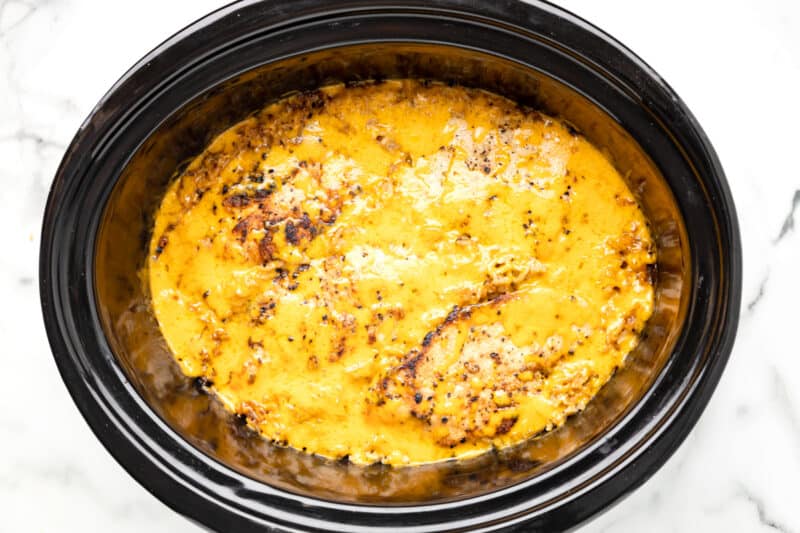 cheese melted over crockpot no peek chicken in a crockpot.