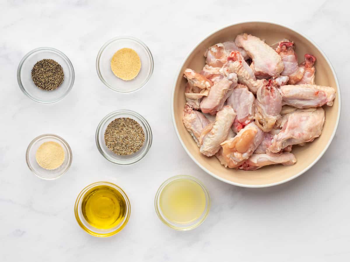 overhead view of ingredients for lemon pepper wings in individual bowls.