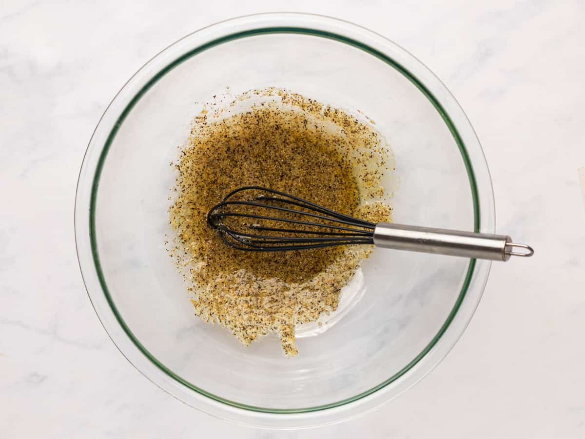 sauce for lemon pepper wings in a glass bowl.