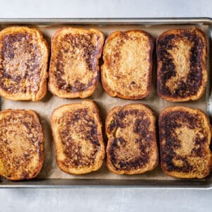 8 slices of french toast on a baking sheet.