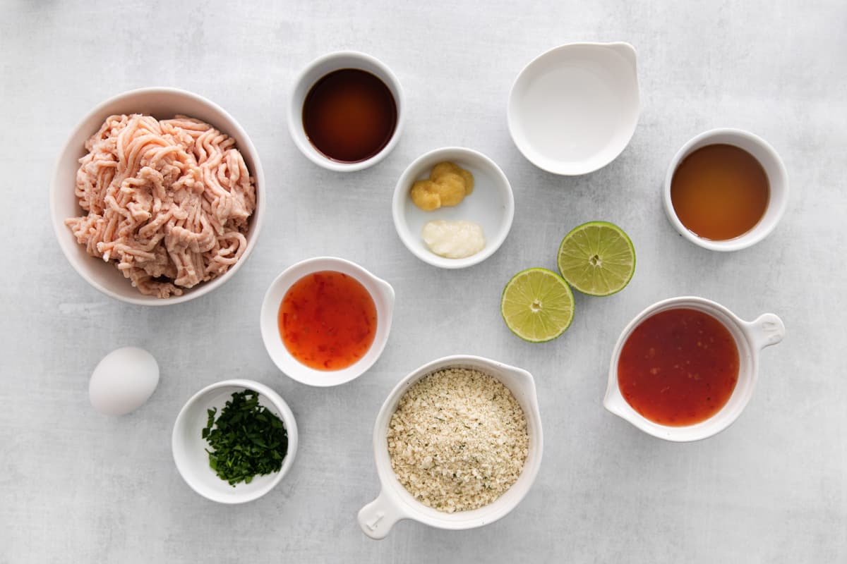 Ingredients for Thai sweet chili chicken meatballs arranged in small bowls.