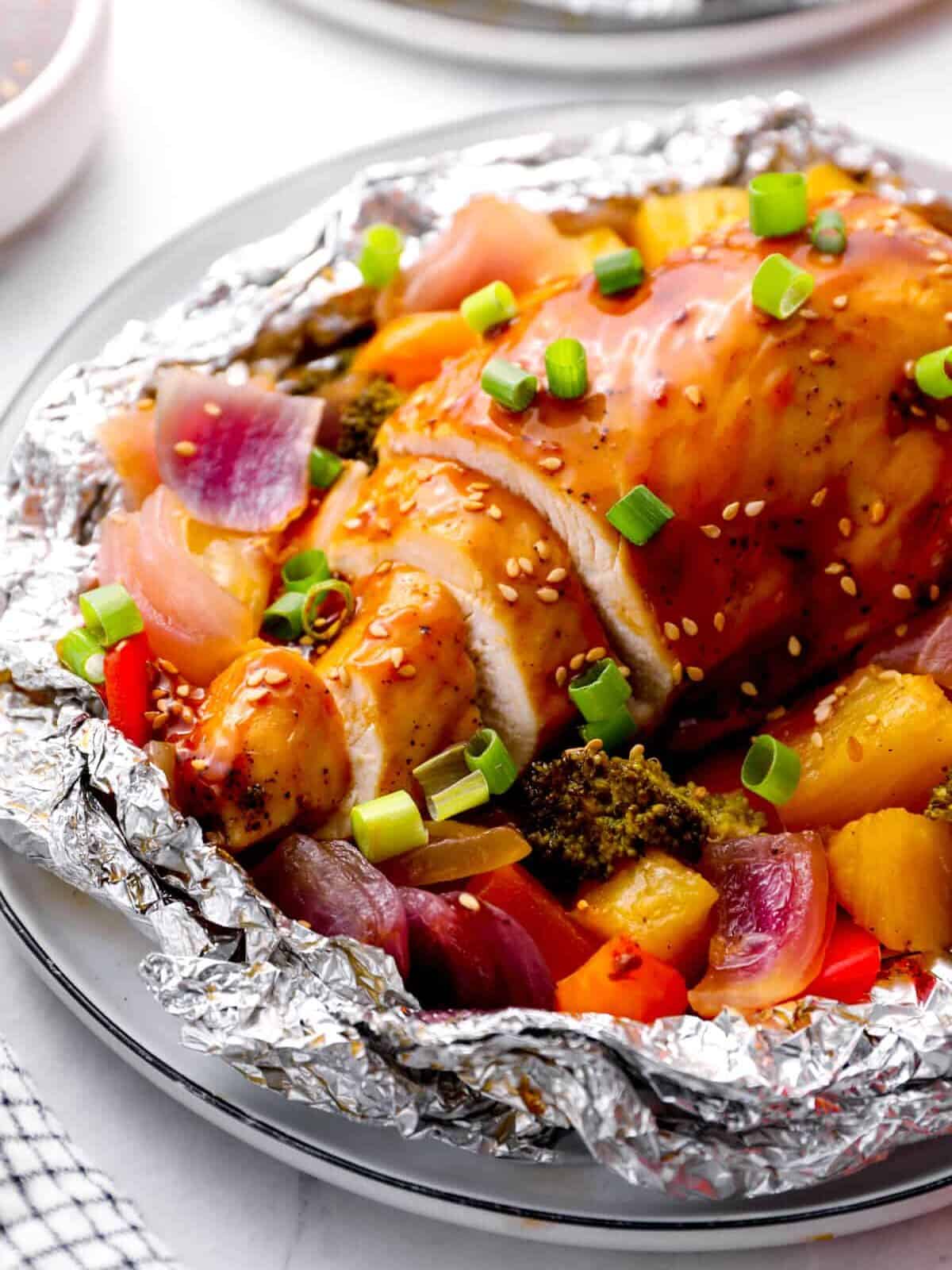 teriyaki chicken in a foil packet with veggies