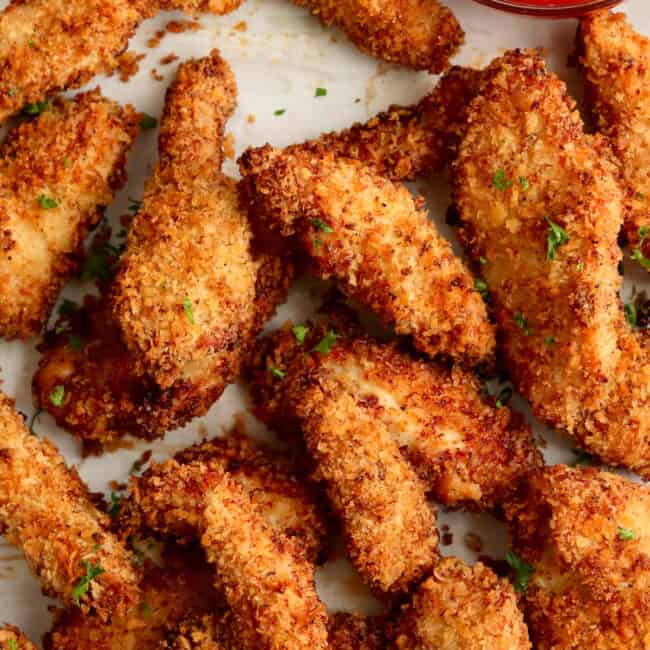 Air-fried chicken wings with ketchup on a plate.