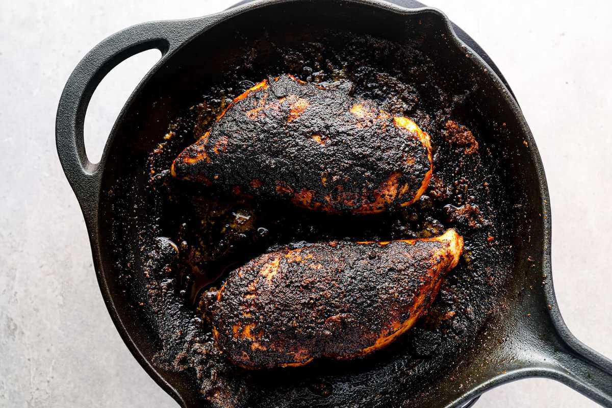 blackened chicken in a cast iron skillet