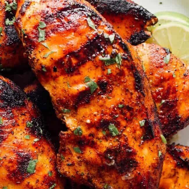 up close image of grilled chicken breast with marinade