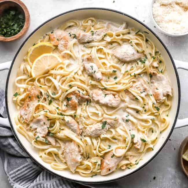 overhead view of chicken alfredo in a white pan.