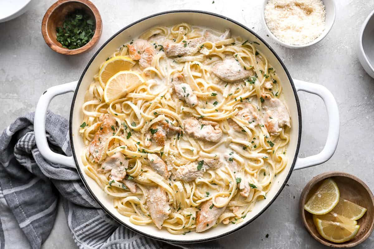 overhead view of chicken alfredo in a white pan.