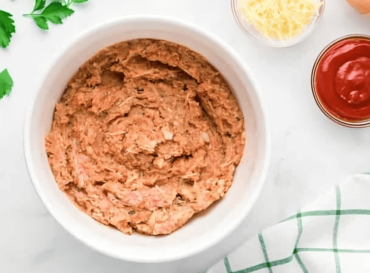 chicken meatloaf mixture in a white bowl.