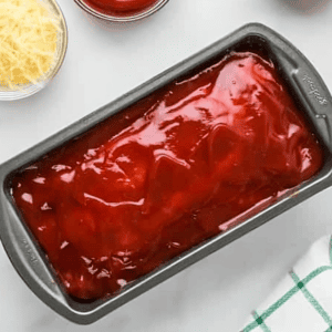 glazed chicken meatloaf in a pan.