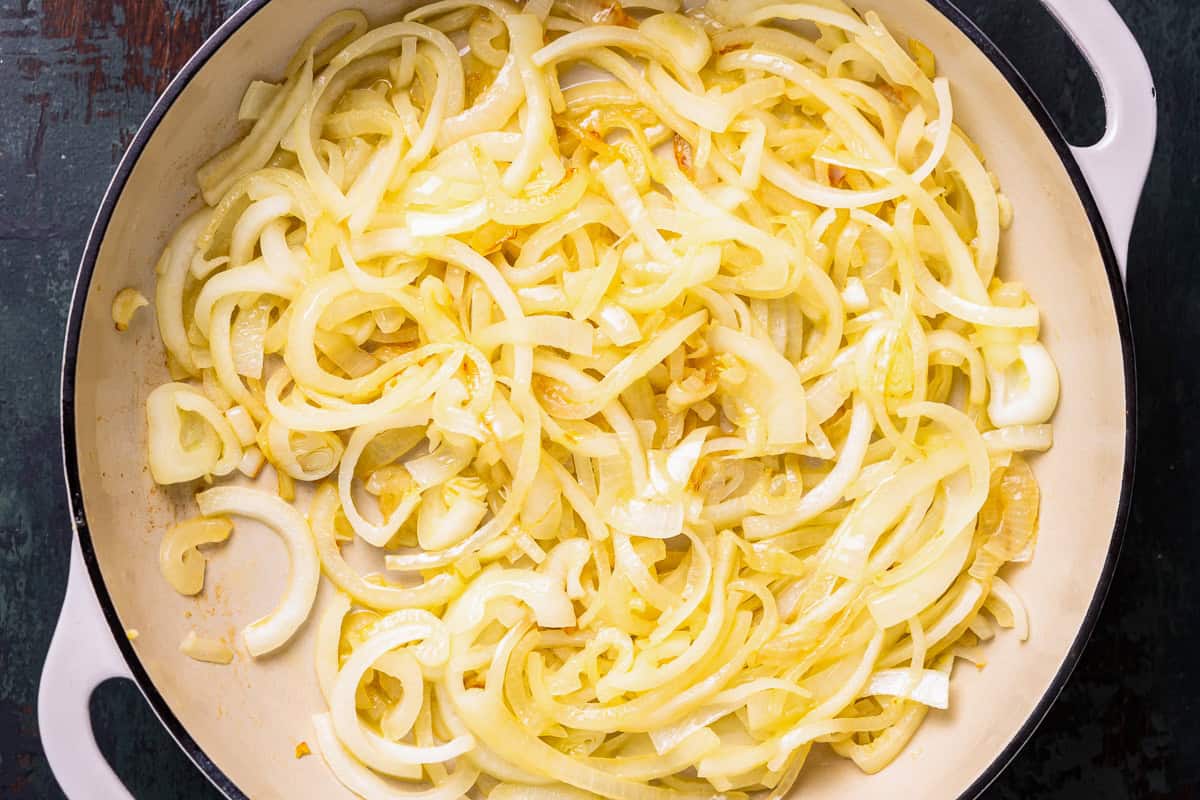 sliced onions in a pan.